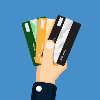 hand holds various types of credit cards